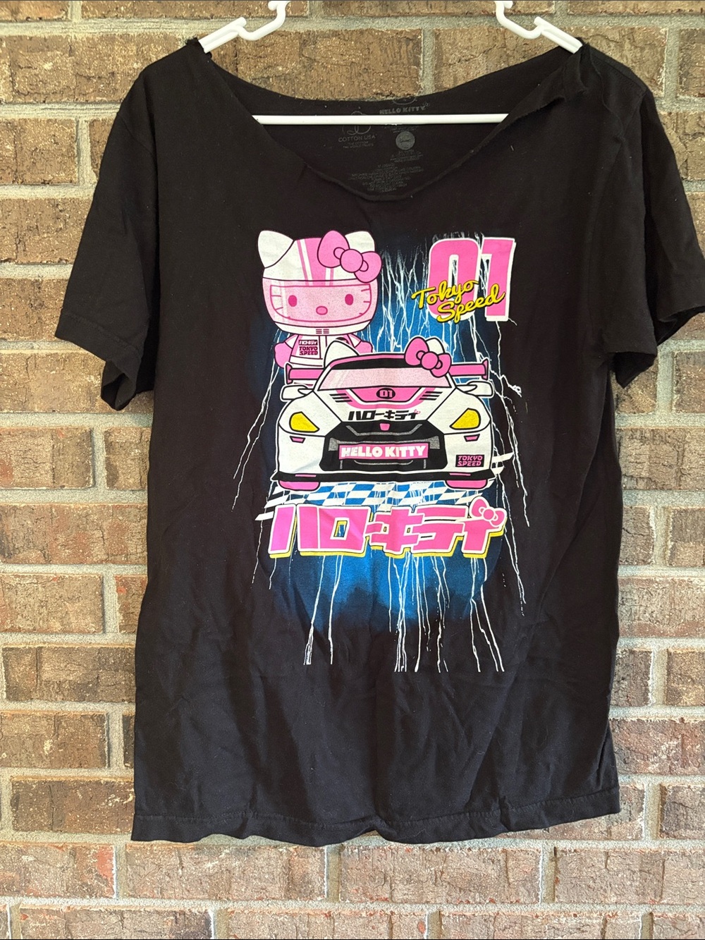 Hello Kitty Black Tee with Pink Racing Car Graphic